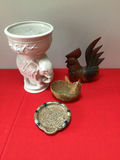 Decorative ceramic planter with floral relief, wooden rooster, wicker basket, and ceramic plate - thumbnail 1 of 2