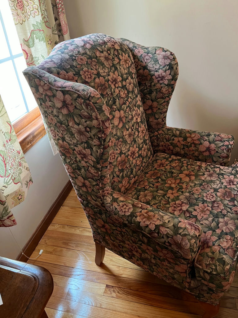 Floral patterned wingback armchair and small oval footstool - image 2 of 3