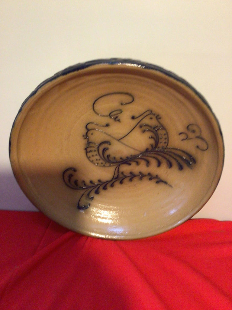 Ceramic bowl with blue rim and floral interior - image 1 of 3