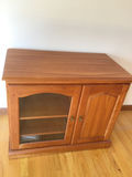 Wooden cabinet with glass-front left compartment and solid right door - thumbnail 1 of 3