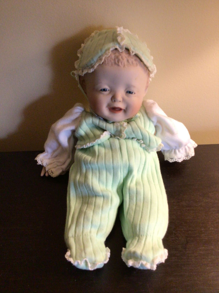 Vintage doll in mint-green outfit with lace bonnet - image 1 of 3