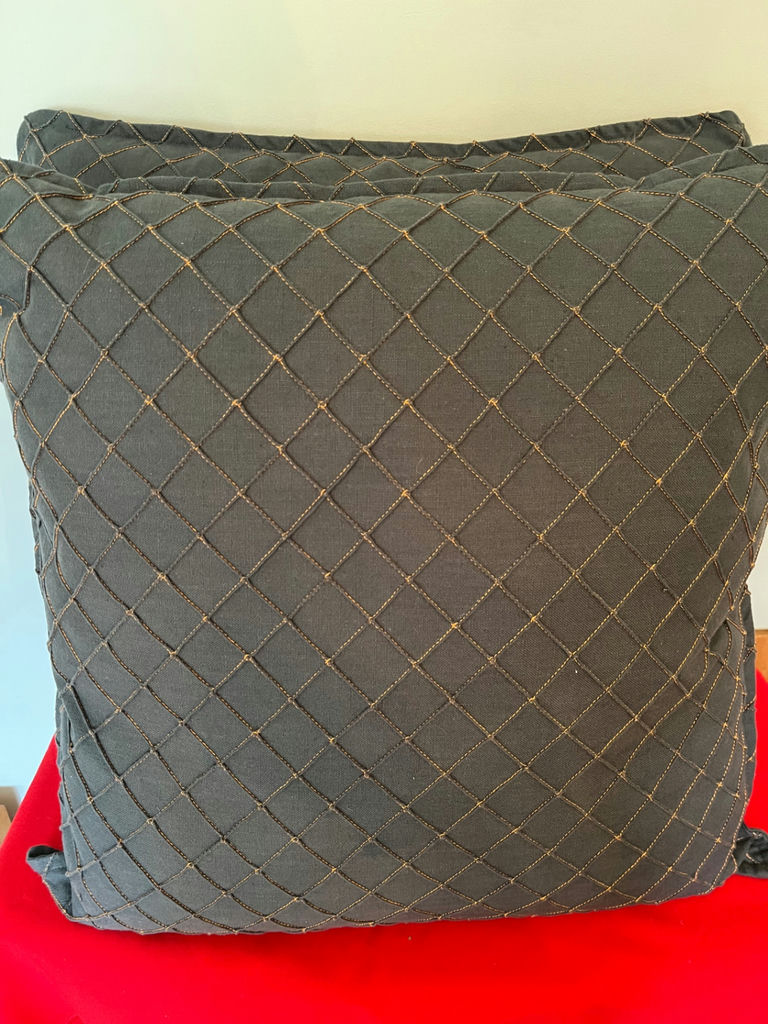 Two grey quilted throw pillows with orange thread accent 25x 25 - image 1 of 2