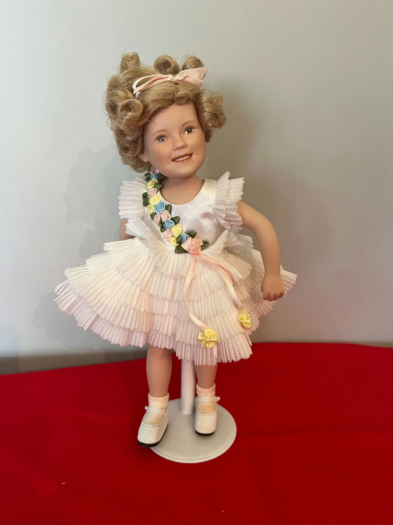 Shirley Temple Doll with White Pleated Dress and Floral Sash - image 1 of 2