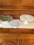 Floral patterned plate on pedestal, iridescent glass plate, and white pedestal cake stand - thumbnail 1 of 5