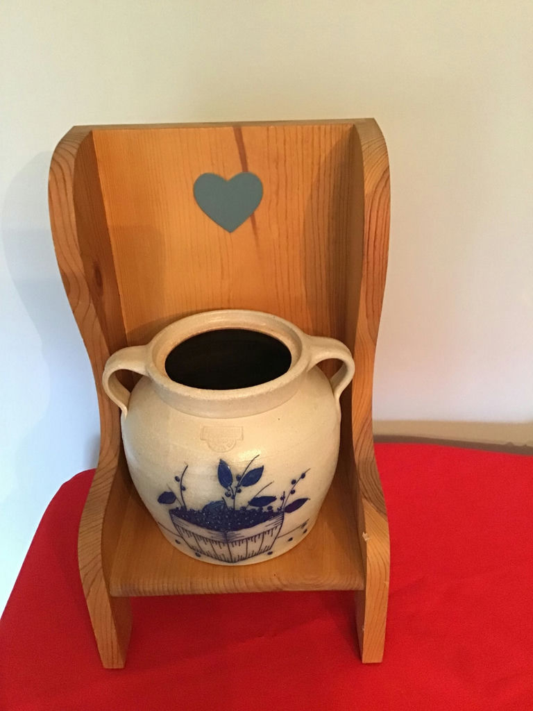 Blue-and-white ceramic jug on a heart-cut wooden display shelf - image 1 of 1