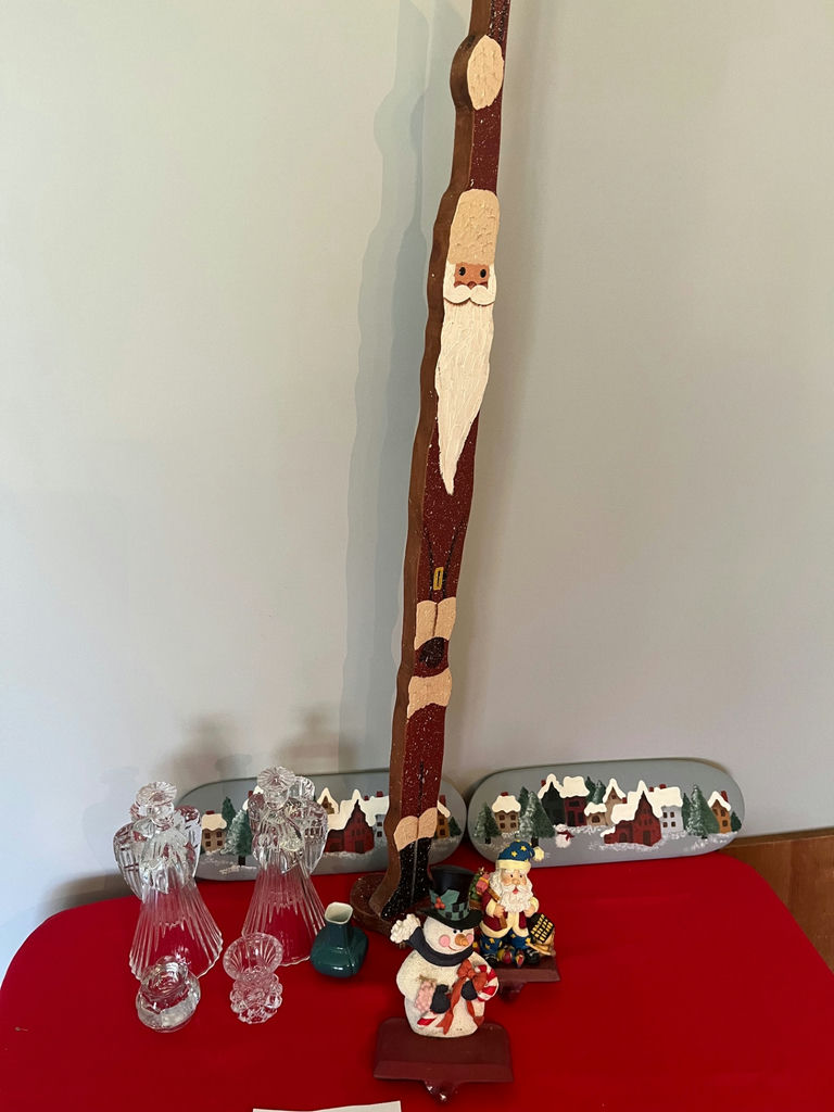 Tall carved Santa figure with Christmas village decor and crystal glassware - image 1 of 1