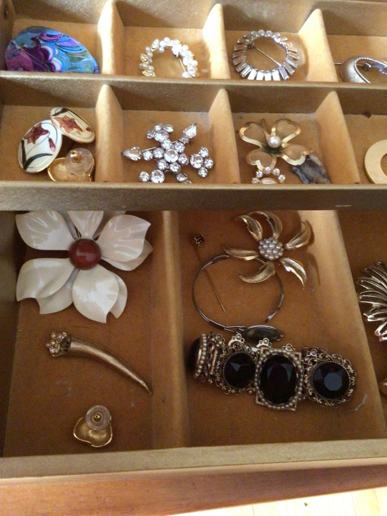 Assorted jewelry in a compartmentalized storage box - image 2 of 4