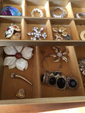 Assorted jewelry in a compartmentalized storage box - thumbnail 2 of 4