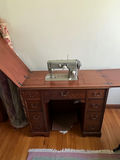 Vintage Pfaff 230 sewing machine on wooden desk - thumbnail 1 of 2