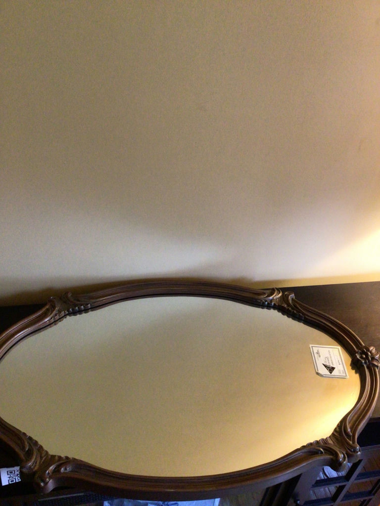 Ornate oval wooden-framed mirror - image 1 of 3