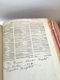 Open antique dictionary with pressed leaf and handwritten inscription - thumbnail 3 of 4