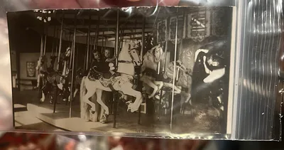 Kids Riding A merry-go-round Photograph - Image 1 of 3