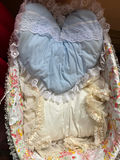 Porcelain baby doll in blue lace-trimmed gown in wicker cradle - thumbnail 4 of 6