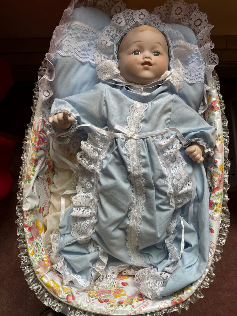 Porcelain baby doll in blue lace-trimmed gown in wicker cradle - image 2 of 6