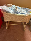 Porcelain baby doll in blue lace-trimmed gown in wicker cradle - thumbnail 3 of 6