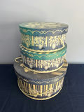Stack of decorative round hat boxes with teal and gold patterns - thumbnail 1 of 2