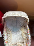 Porcelain baby doll in blue lace-trimmed gown in wicker cradle - thumbnail 5 of 6