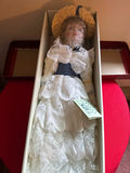Dynasty Doll Collection porcelain doll in lace gown with hat - thumbnail 1 of 5