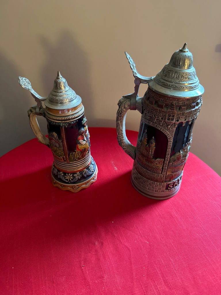 Two decorative beer steins with pewter lids - image 1 of 6