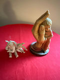 Religious figurine group: hand sculpture cradling a baby and a Tiffany cherub - thumbnail 2 of 4
