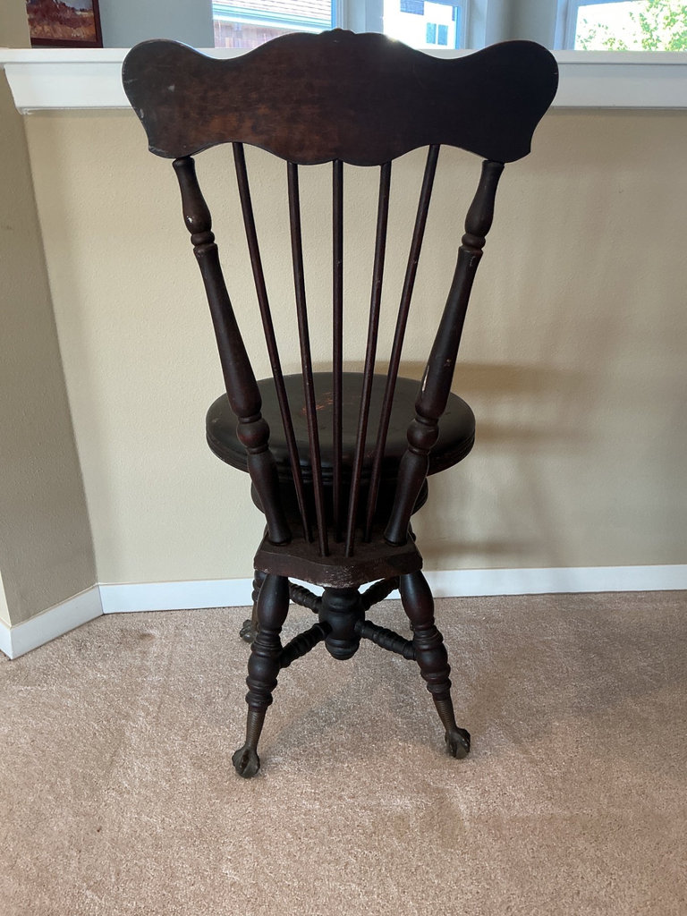 Antique Dark wood spindle-back chair with claw feet - image 1 of 6