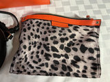 Orange tote bag, black round crossbody bag, and leopard-print zipper pouch - thumbnail 3 of 6