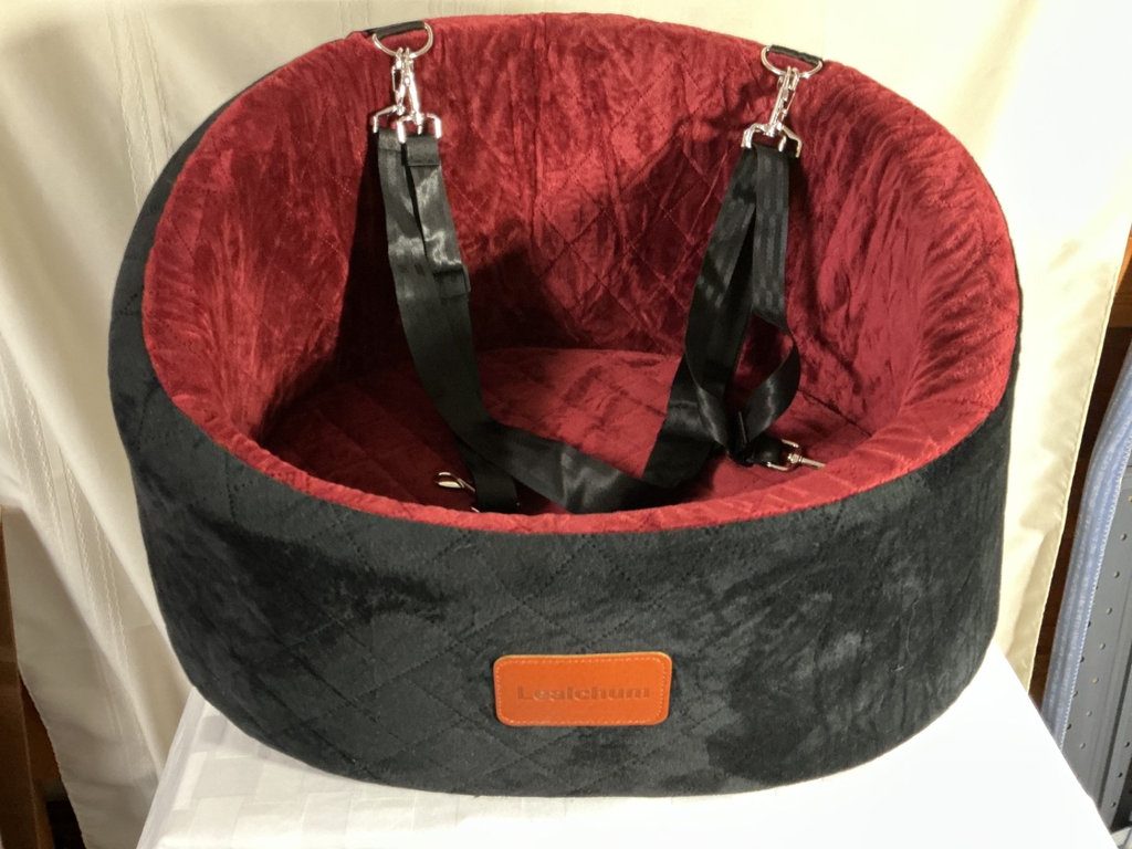 Round plush pet bed with harness straps - image 1 of 3