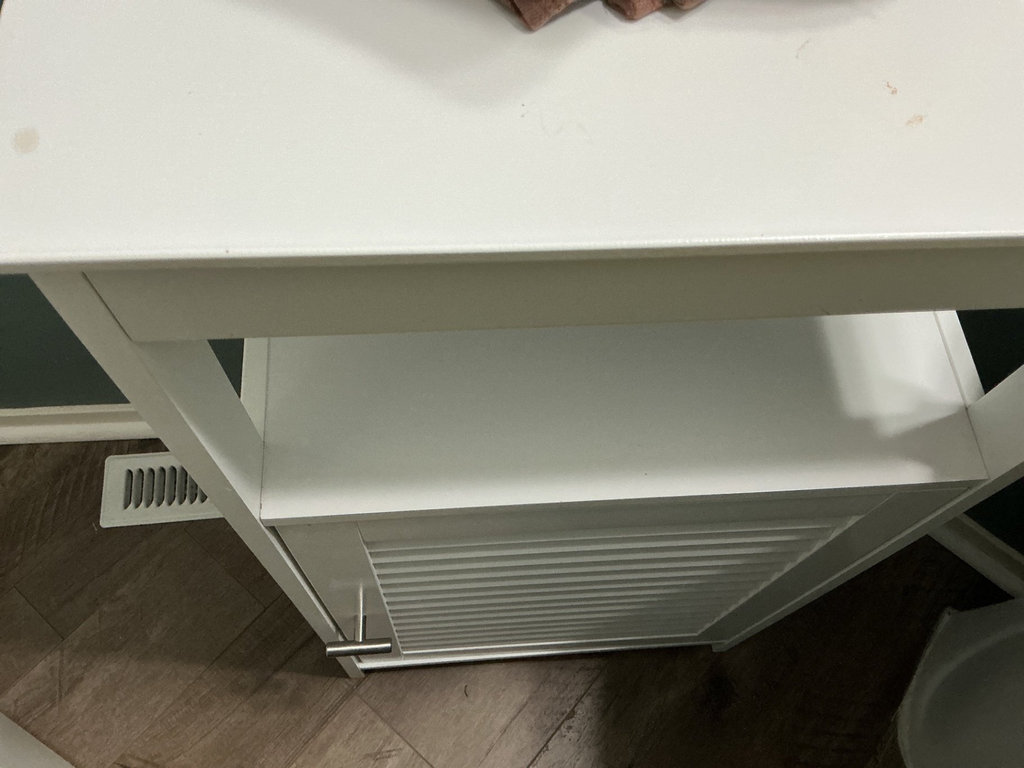 White wooden cabinet with louvered door and napkins - image 2 of 4