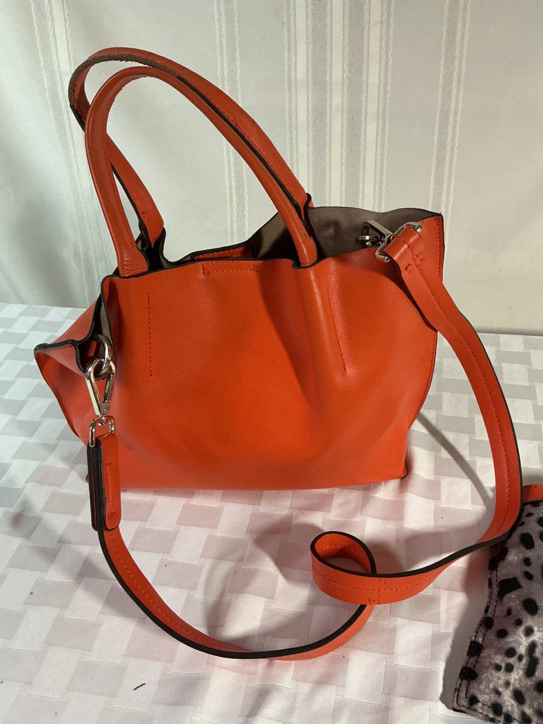 Orange tote bag, black round crossbody bag, and leopard-print zipper pouch - image 4 of 6
