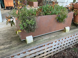 Rectangular rust-colored planters filled with plants - thumbnail 4 of 4