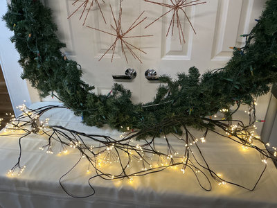 Evergreen wreath with lights and copper starburst ornaments - Image 1 of 4