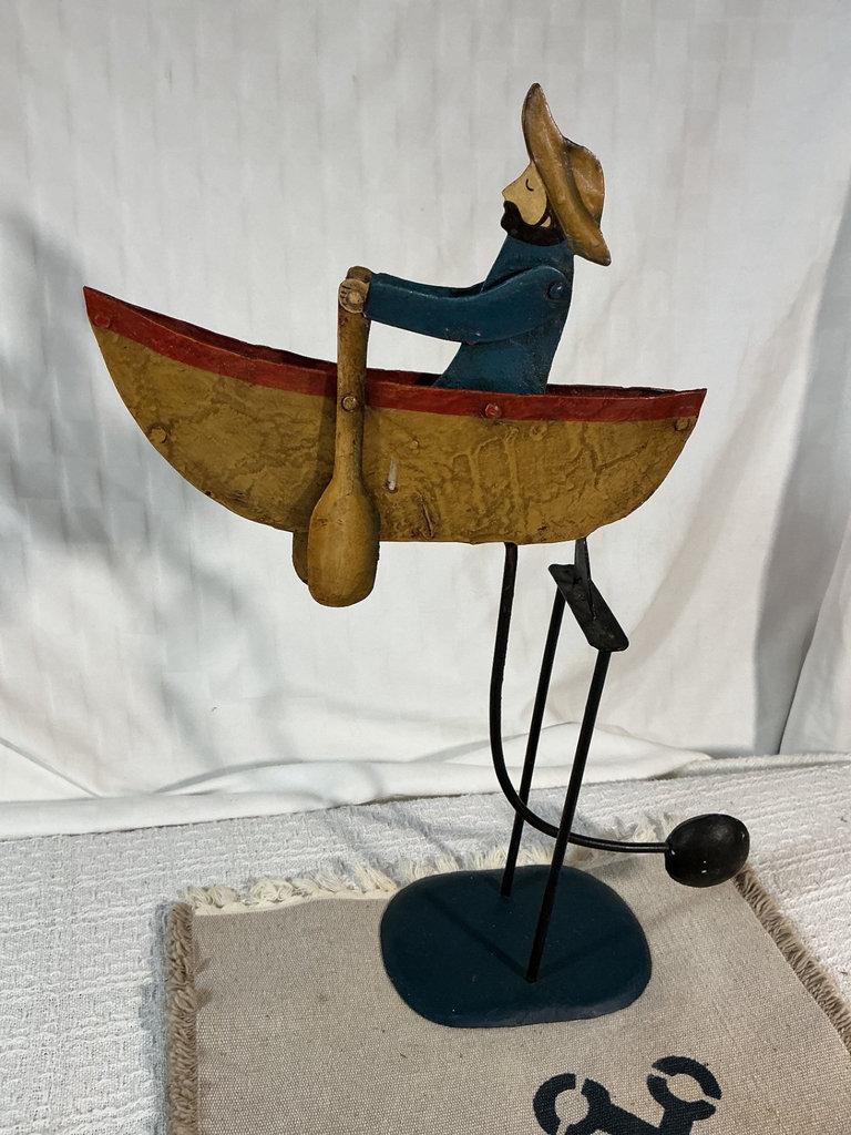 Folk-art canoeist sculpture on stand - image 1 of 3