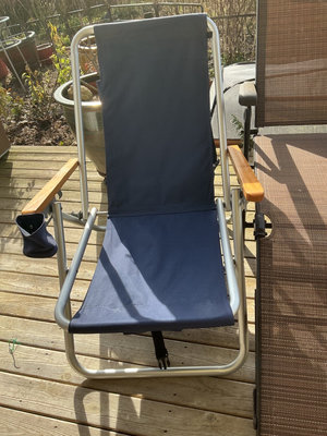 Outdoor lounge chairs and grilling skewers - Image 1 of 8