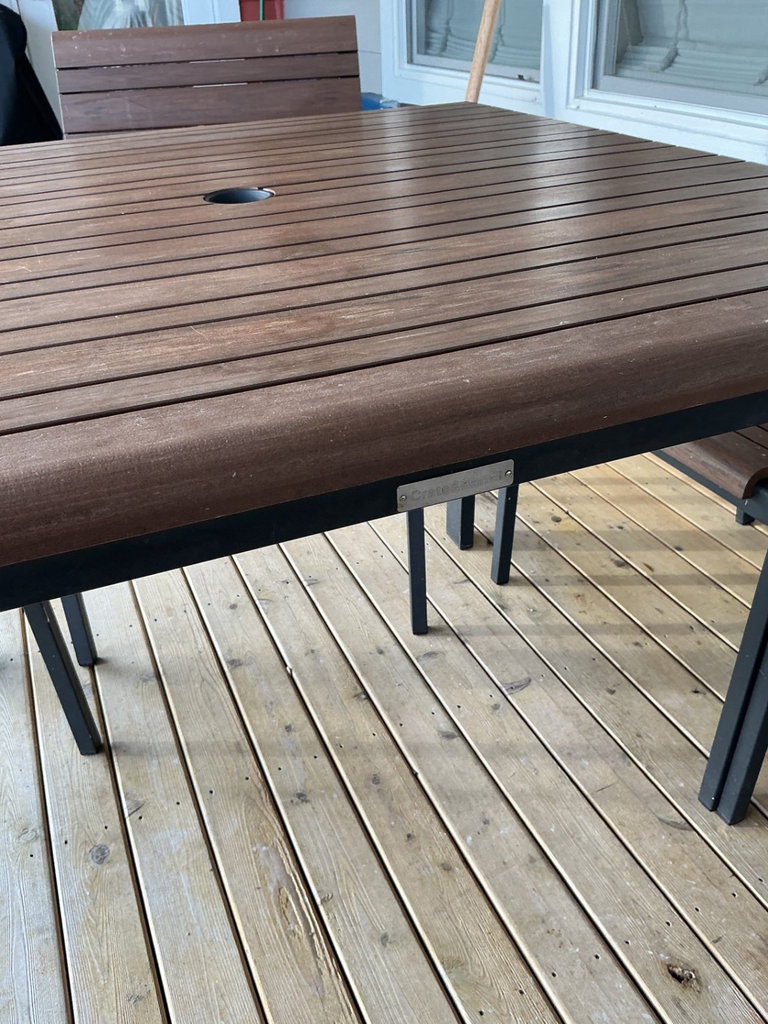 Crate & Barrel Outdoor dining table with four wooden slat chairs - image 2 of 8