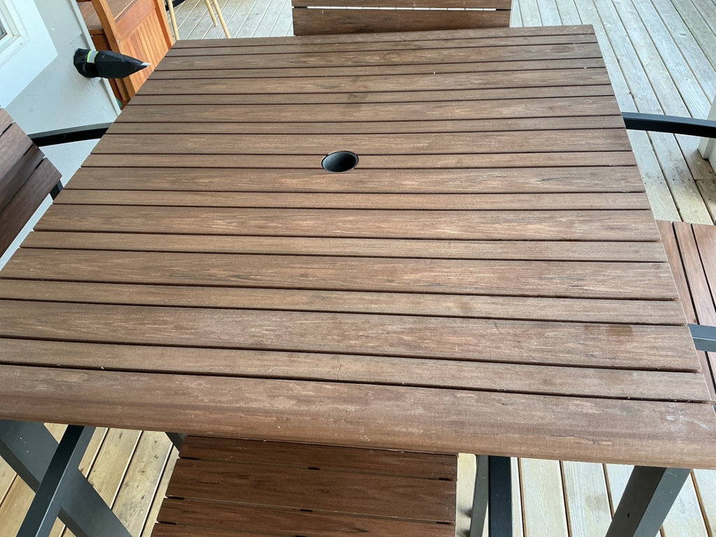 Crate & Barrel Outdoor dining table with four wooden slat chairs - image 3 of 8
