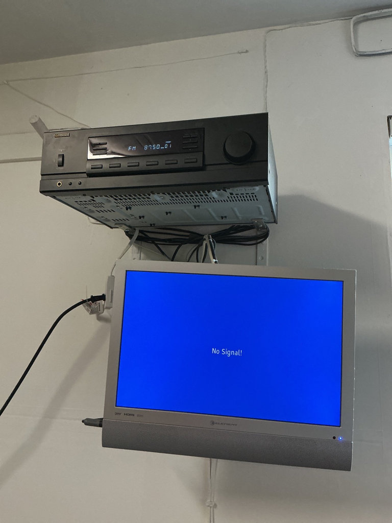 AM/FM stereo receiver RX-4105 with wall-mounted audio components - image 1 of 3