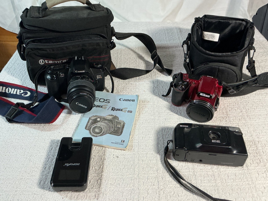 Canon EOS Rebel G kit with Nikon red camera and accessories - image 1 of 8