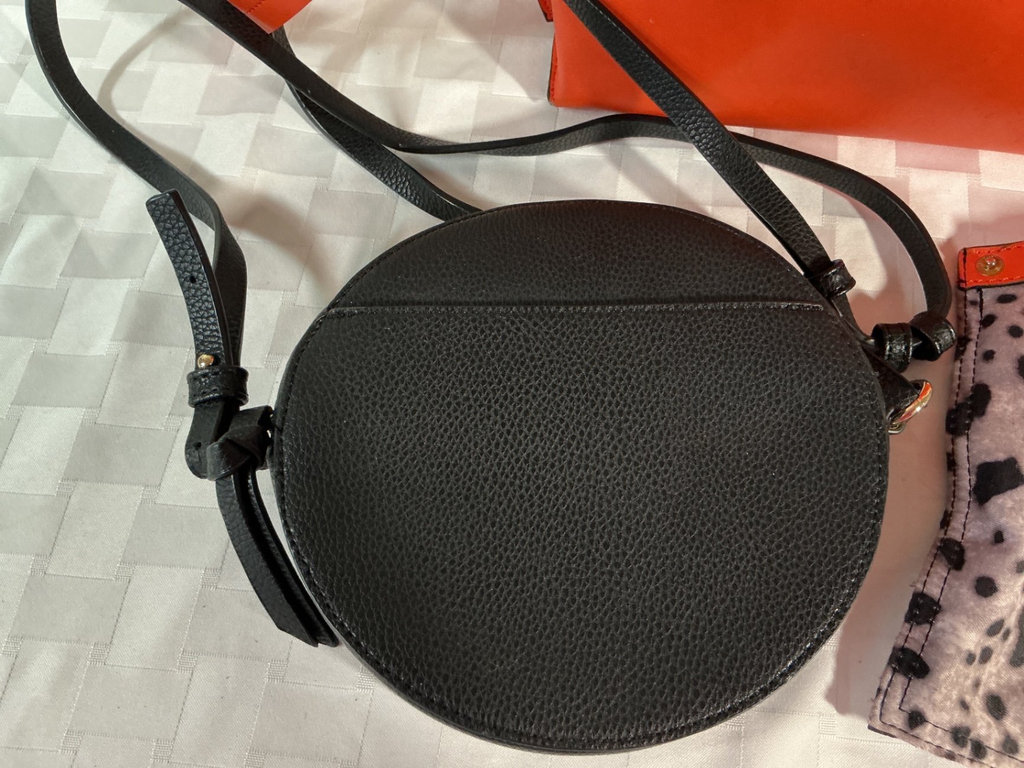 Orange tote bag, black round crossbody bag, and leopard-print zipper pouch - image 1 of 6