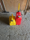 Yellow and Red Plastic Gas Cans A - thumbnail 1 of 4