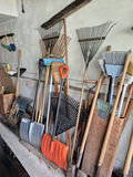 Assorted Yard Tools Including Brooms, Rakes, and Shovels - thumbnail 3 of 3