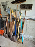 Assorted Yard Tools Including Brooms, Rakes, and Shovels - thumbnail 2 of 3