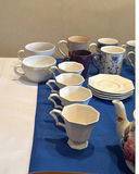 Assorted Ceramic Mugs, Teapots, and Saucers - thumbnail 6 of 7