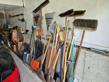 Assorted Yard Tools Including Brooms, Rakes, and Shovels - thumbnail 1 of 3