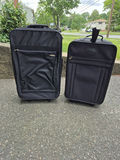 Two Black Rolling Suitcases - thumbnail 1 of 5