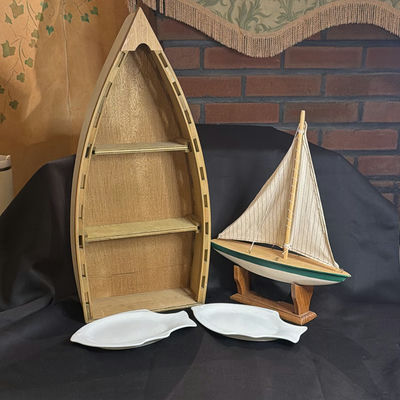 Nautical Decor Lot: Boat Shelf, Sailboat Model, and Williams Sonoma Fish Shaped Dishes - Image 1 of 10