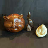 Vintage Lot Including Wooden Pig Bank, Pelican Carving and Abstract Goddes Figurine - thumbnail 1 of 6