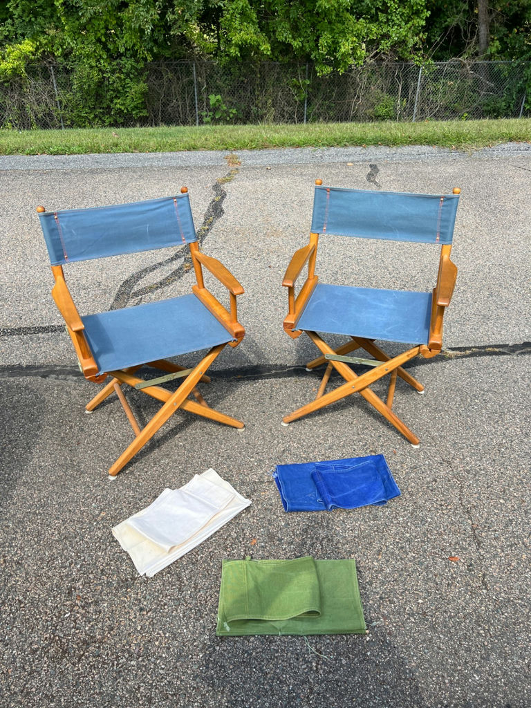 Pair of folding director's chairs with blue fabric and three additional cloth seat sets - image 1 of 6