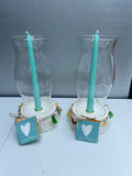 Pair of coastal candle holders with teal candles - thumbnail 1 of 6