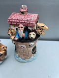 Three ceramic figurines: salt and pepper shakers pink-roofed houses and a brick-tower scene - thumbnail 2 of 5