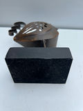 Rusty metal bird sculpture on a black pedestal - thumbnail 3 of 3